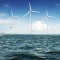 White wind turbine generating electricity on sea